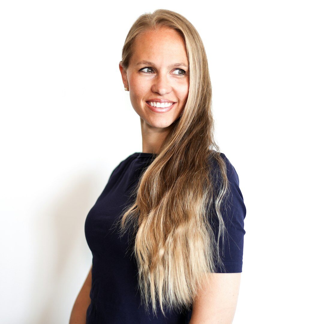 Portrait of the editor-in-chief, a woman in her 40s smiling confidently