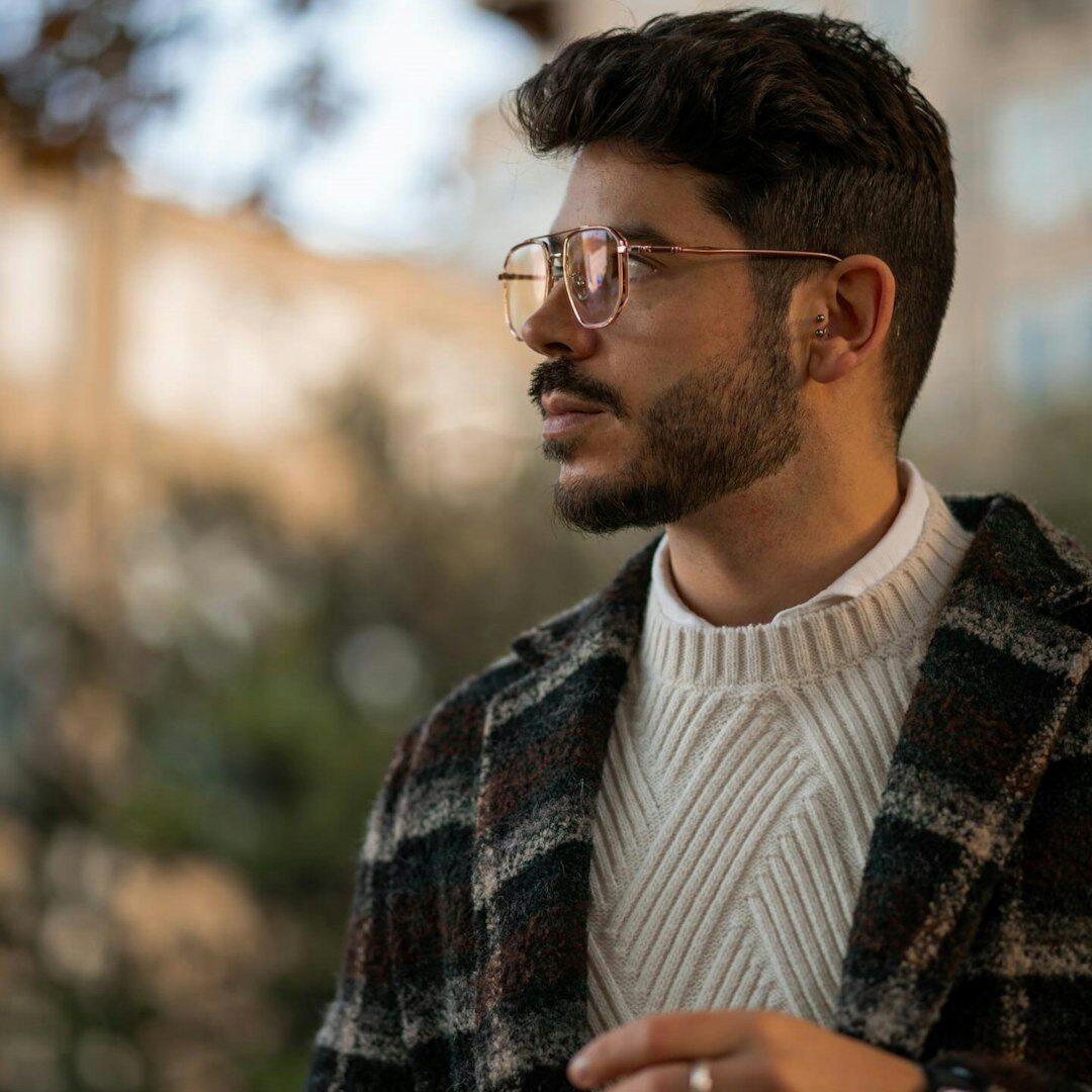Portrait of the fashion editor, a young man with glasses